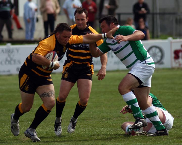 Darren Jacques Hands off a Devon tackler.jpg - Darren Jacques Hands off a Devon tackler. Photo by John Beach.